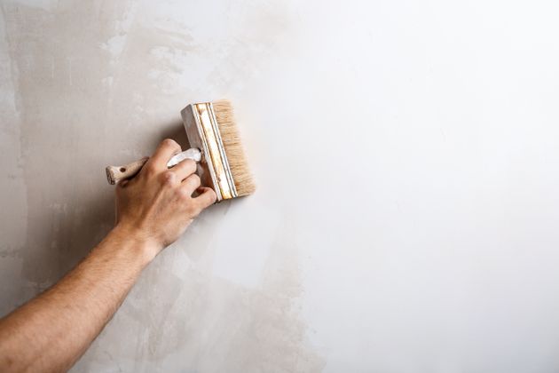 Use spackling paste to fill any holes or cracks in the walls before sanding them smooth.