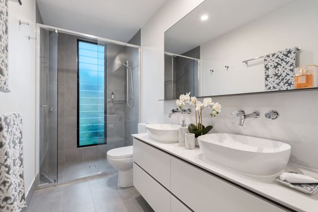 Enhance your bathroom's functionality and style with storage-friendly vanities, water-saving fixtures, spa-like features, and expert layout optimization for a modern and comfortable space.