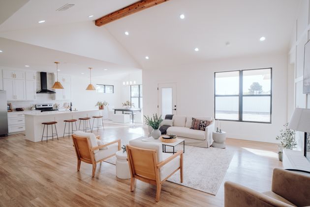 An open floor plan enhances natural lighting, spaciousness, and connection between rooms, offering energy savings and an inviting atmosphere for larger families.